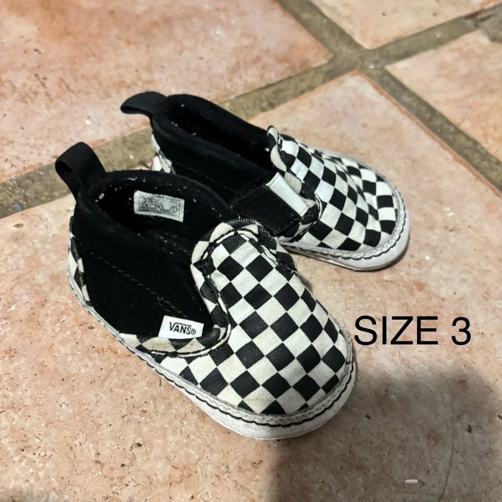 Vans Black and White Checkerboard Slip-On Sneakers